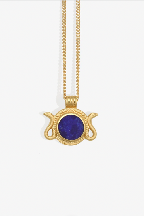 Gold necklace with a blue pendant on a white background